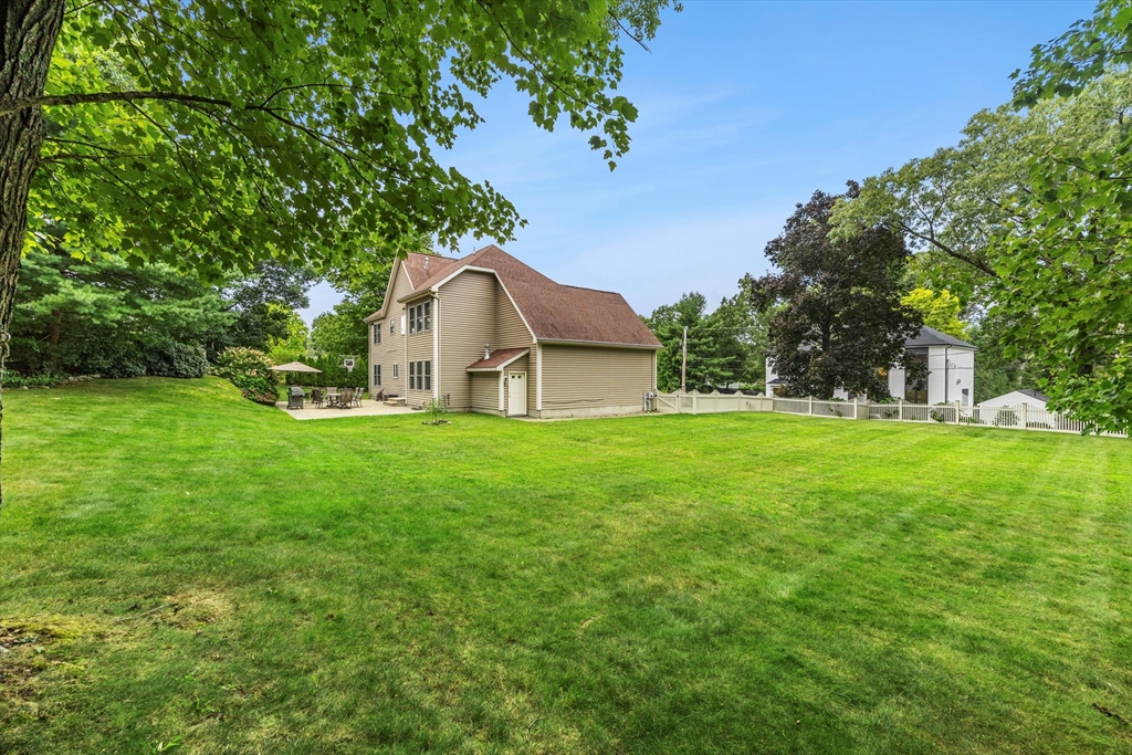 58 Mansfield Road Lynnfield, MA 01940 - Photo 39 of 42 a view of a house with a yard
