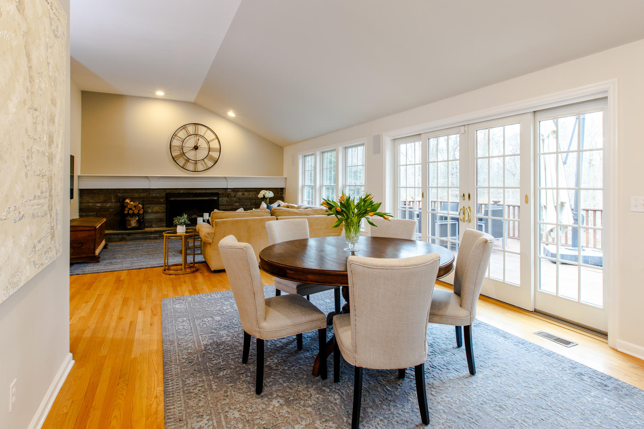 54 Rocky Brook Road New Canaan, CT 06840 - Photo 12 of 25 a view of a dining room with furniture a chandelier and wooden floor