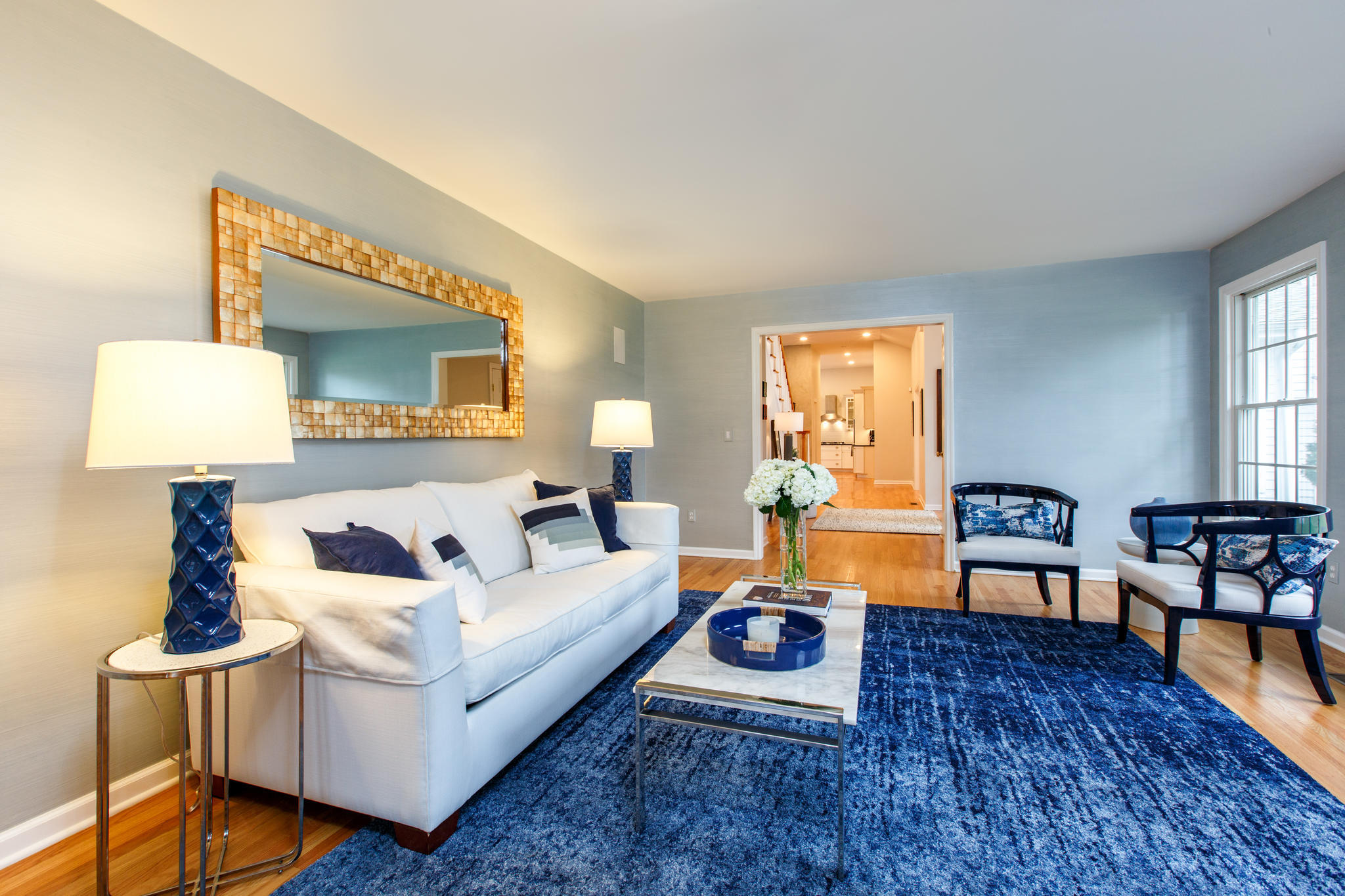 54 Rocky Brook Road New Canaan, CT 06840 - Photo 6 of 25 a living room with furniture and a wooden floor