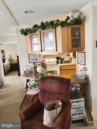 a living room with furniture a fireplace and a floor to ceiling window
