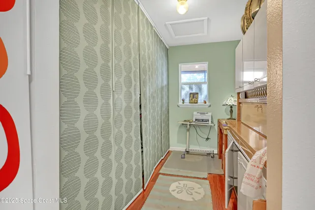 a view of a bathroom with sink and mirror