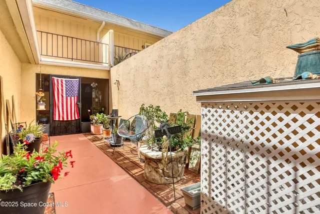 a view of balcony with furniture