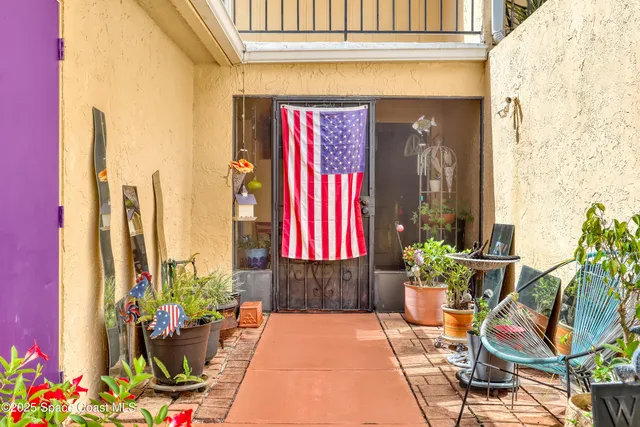 a front view of a house with chairs