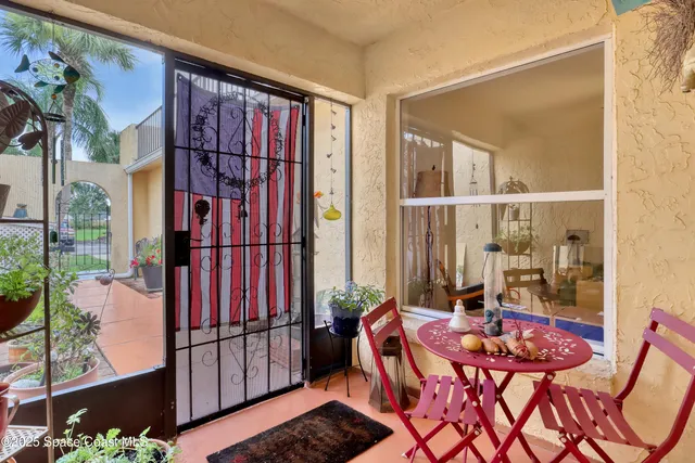 a view of balcony with furniture and wooden floor