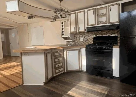 a kitchen with stainless steel appliances granite countertop a stove and a sink