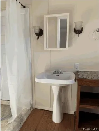 a bathroom with a sink and a mirror