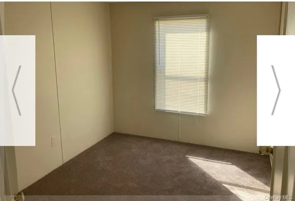 a view of a room that has a window in it