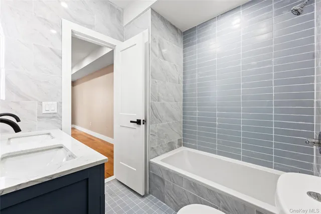 a bathroom with a sink and a bathtub