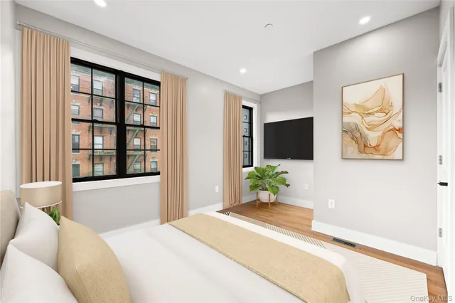 a bedroom with a bed and a view of bathroom