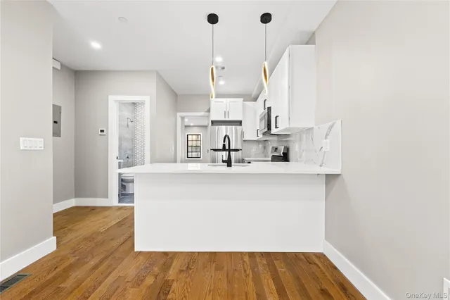 a view of kitchen with wooden floor