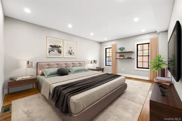 a bedroom with a large bed and a couch