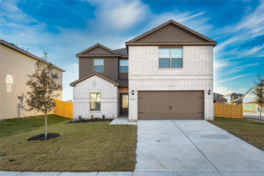 274 Honeysuckle Lane Princeton, TX 75407 - Photo 1 of 35 View of front of property featuring concrete driveway, an attached garage, and brick siding