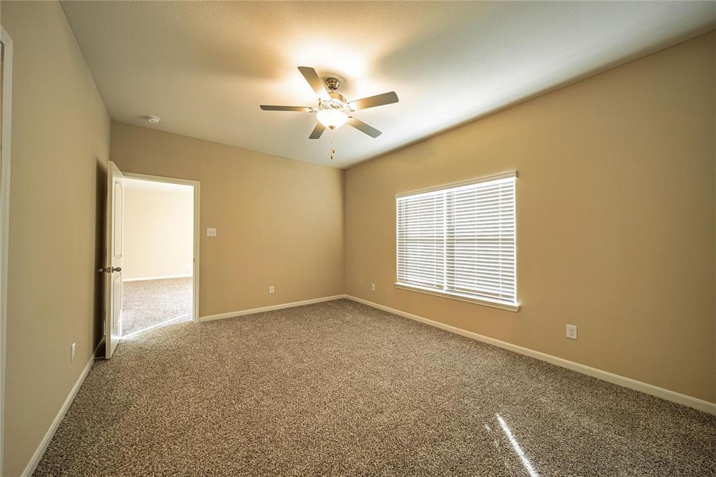 274 Honeysuckle Lane Princeton, TX 75407 - Photo 13 of 35 Spare room with carpet and a ceiling fan