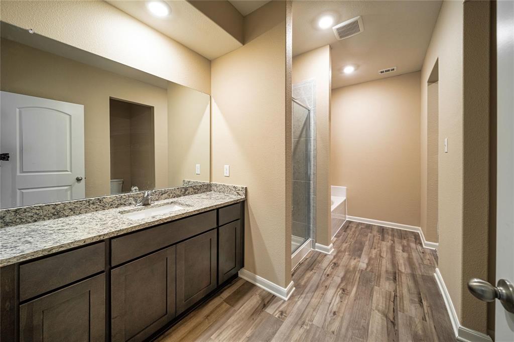274 Honeysuckle Lane Princeton, TX 75407 - Photo 14 of 35 Full bathroom with light wood finished floors, a shower stall, vanity, and recessed lighting
