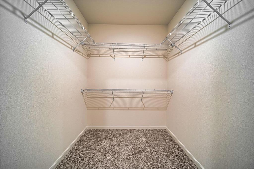 274 Honeysuckle Lane Princeton, TX 75407 - Photo 16 of 35 Spacious closet with dark colored carpet