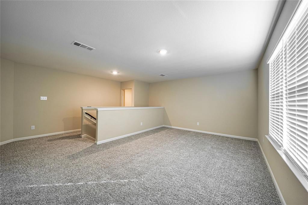 274 Honeysuckle Lane Princeton, TX 75407 - Photo 17 of 35 Empty room featuring light colored carpet