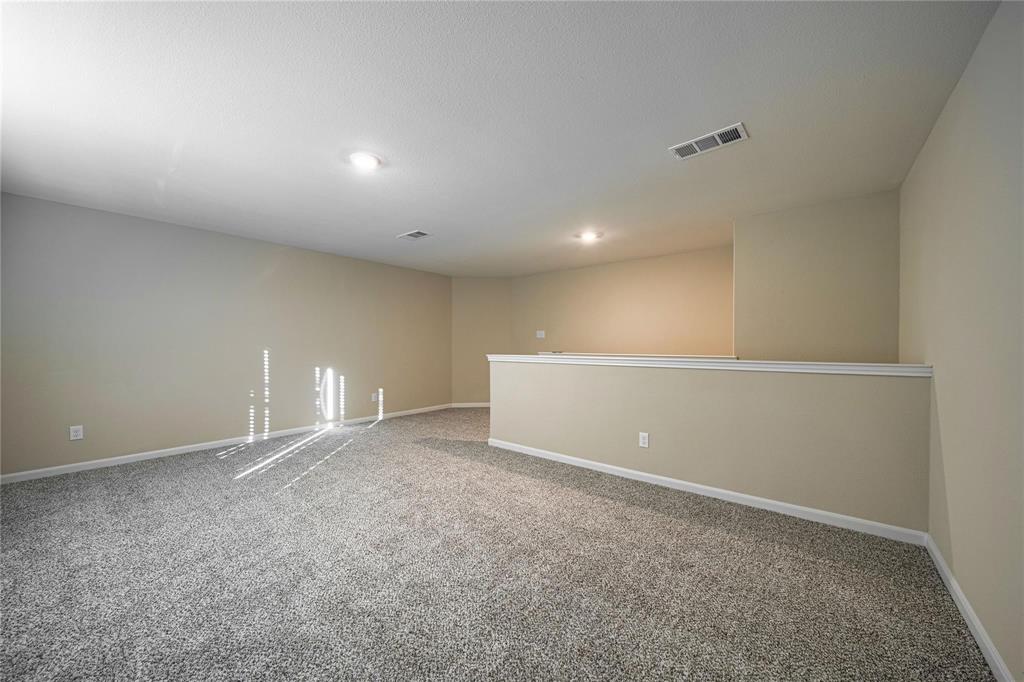 274 Honeysuckle Lane Princeton, TX 75407 - Photo 18 of 35 Carpeted spare room with baseboards and recessed lighting