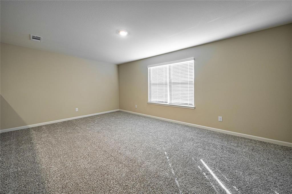 274 Honeysuckle Lane Princeton, TX 75407 - Photo 21 of 35 Spare room with baseboards and carpet flooring