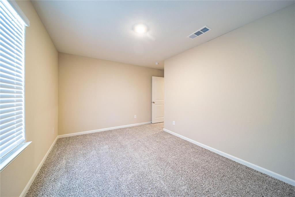 274 Honeysuckle Lane Princeton, TX 75407 - Photo 23 of 35 Carpeted spare room with baseboards