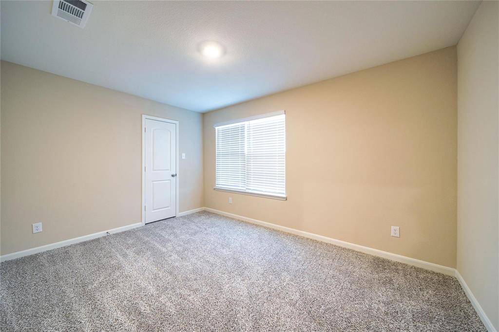 274 Honeysuckle Lane Princeton, TX 75407 - Photo 25 of 35 Carpeted spare room with baseboards