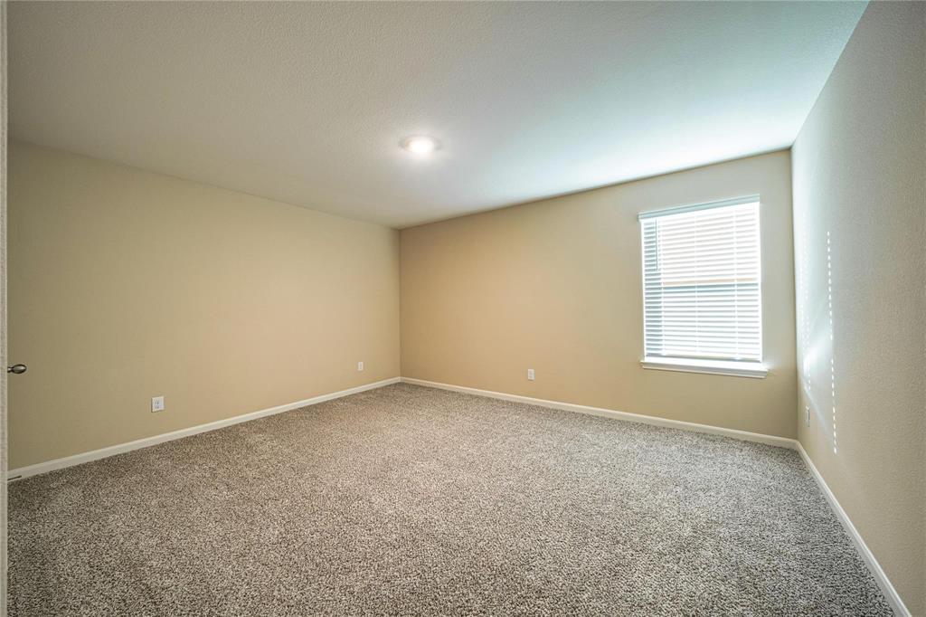 274 Honeysuckle Lane Princeton, TX 75407 - Photo 27 of 35 Carpeted spare room featuring baseboards