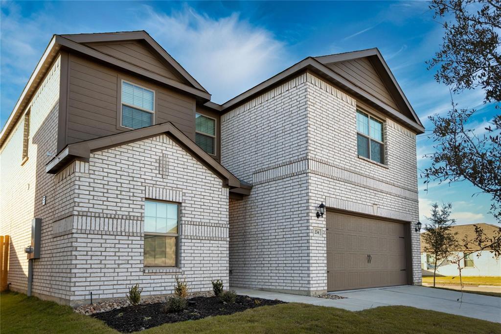 274 Honeysuckle Lane Princeton, TX 75407 - Photo 35 of 35 View of front of house with an attached garage, driveway, and brick siding