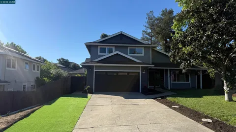 a front view of a house with yard