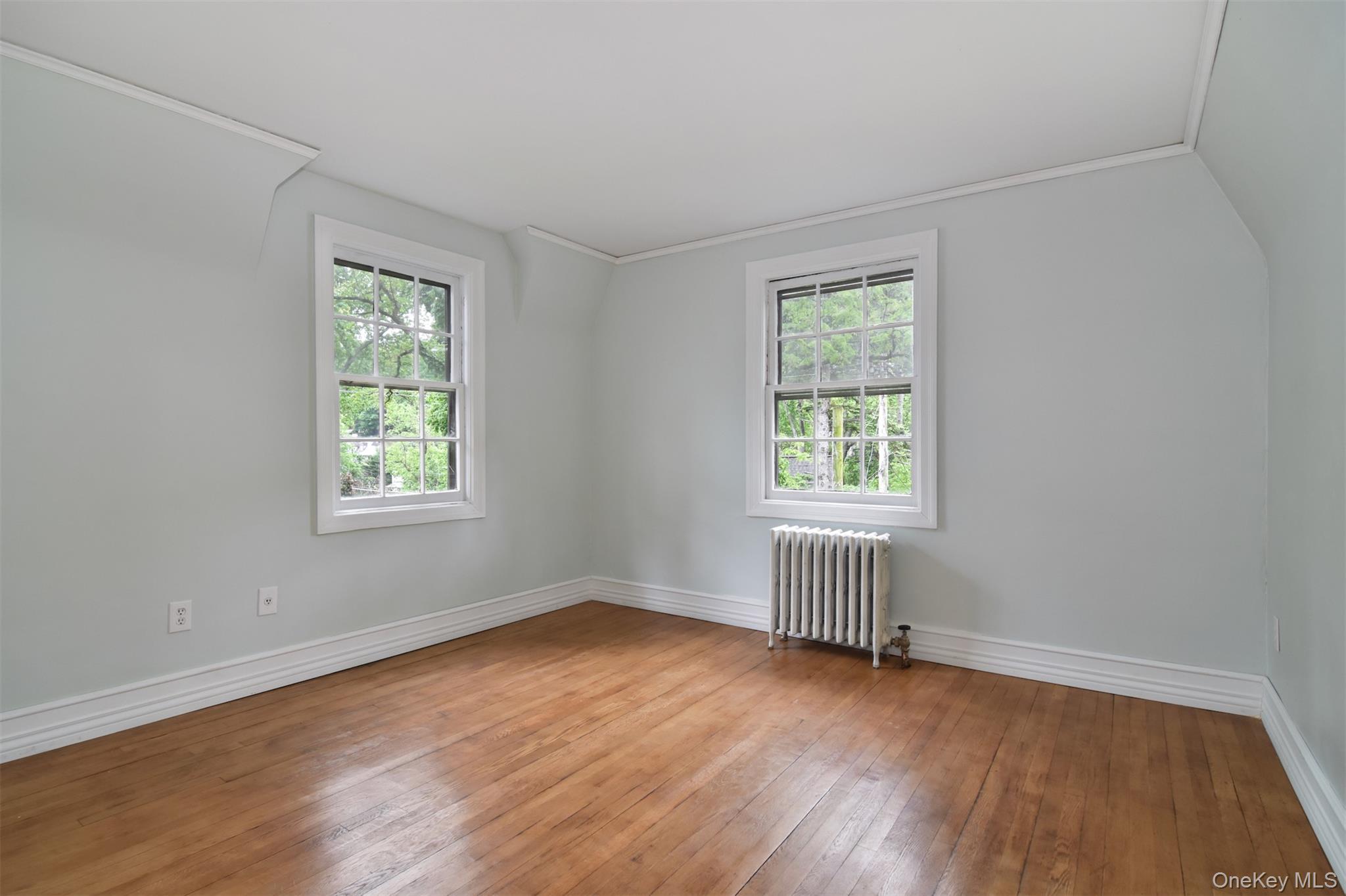 370 Scarsdale Road Tuckahoe, NY 10707 - Photo 22 of 25 Bedroom featuring rich hardwood flooring, light gray wall paint, and white trim
