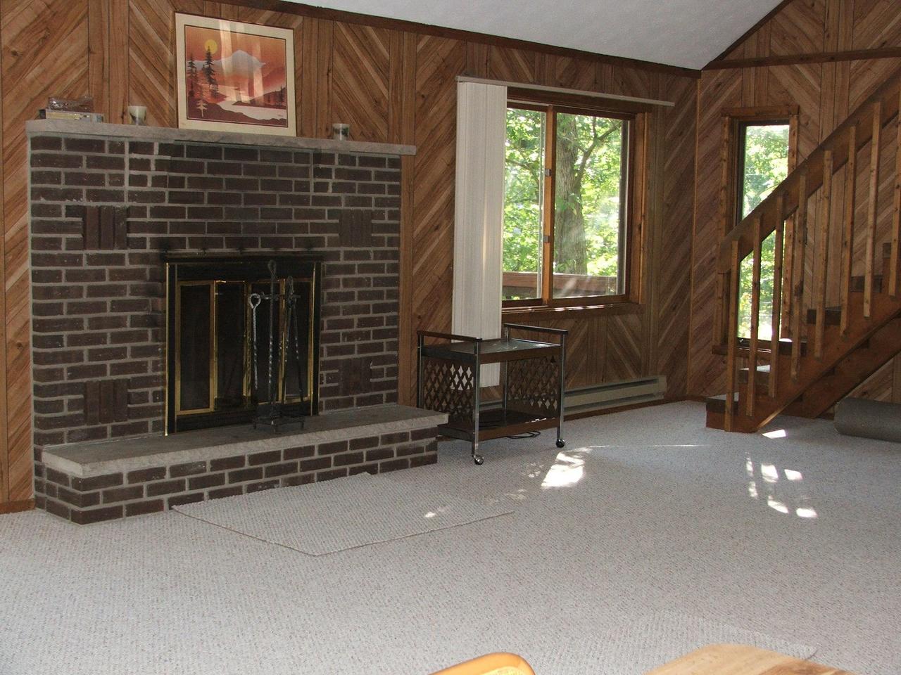657 Radcliff Road Bushkill, PA 18324 - Photo 8 of 10 Center of LR w/ Brk Fireplace