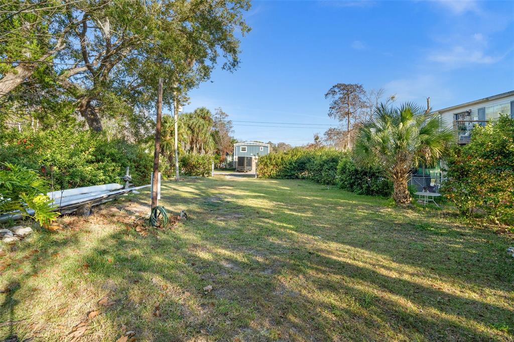7287 Coventry Court Weeki Wachee, FL 34607 - Photo 10 of 16 a view of a field with tree in the background