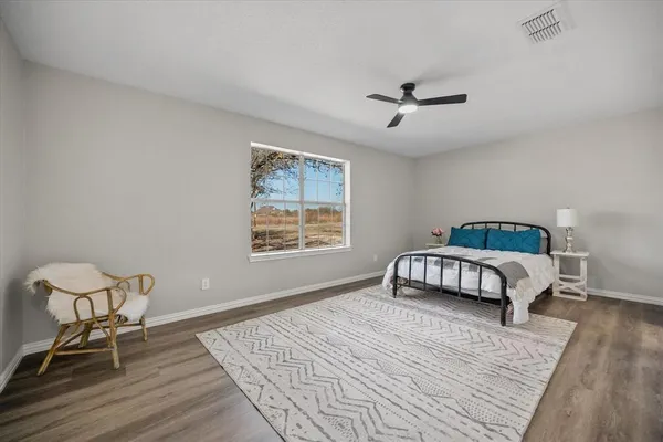 a kitchen with sink cabinets and wooden floor