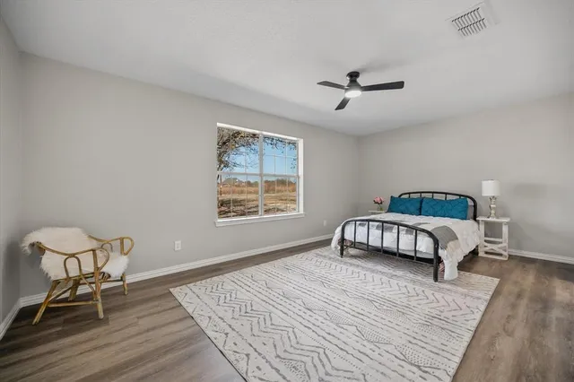 a kitchen with sink cabinets and wooden floor