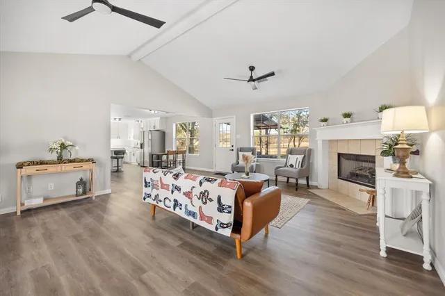 a living room with furniture fireplace and window