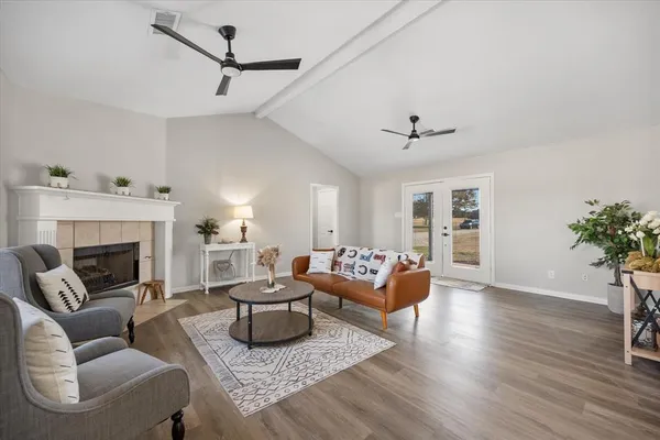 a living room with furniture and a fireplace