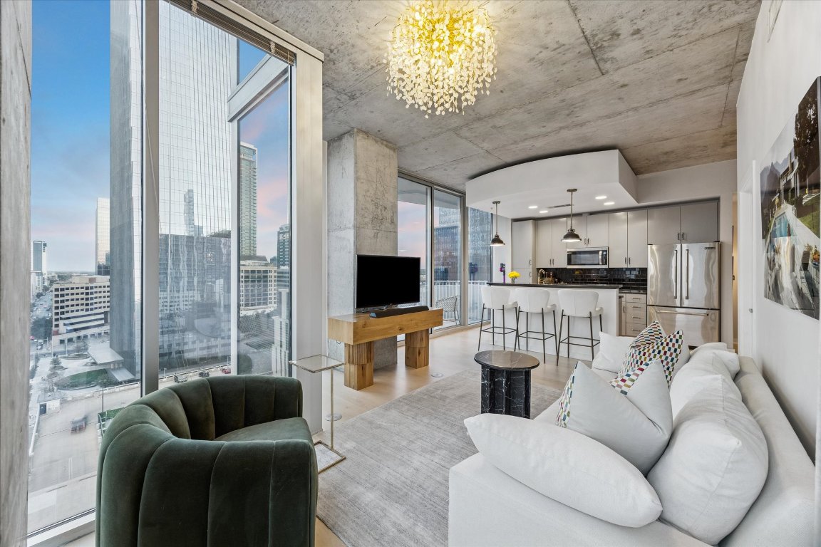 a living room with furniture and a flat screen tv