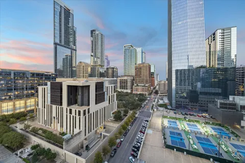 a kitchen with stainless steel appliances kitchen island granite top and refrigerator