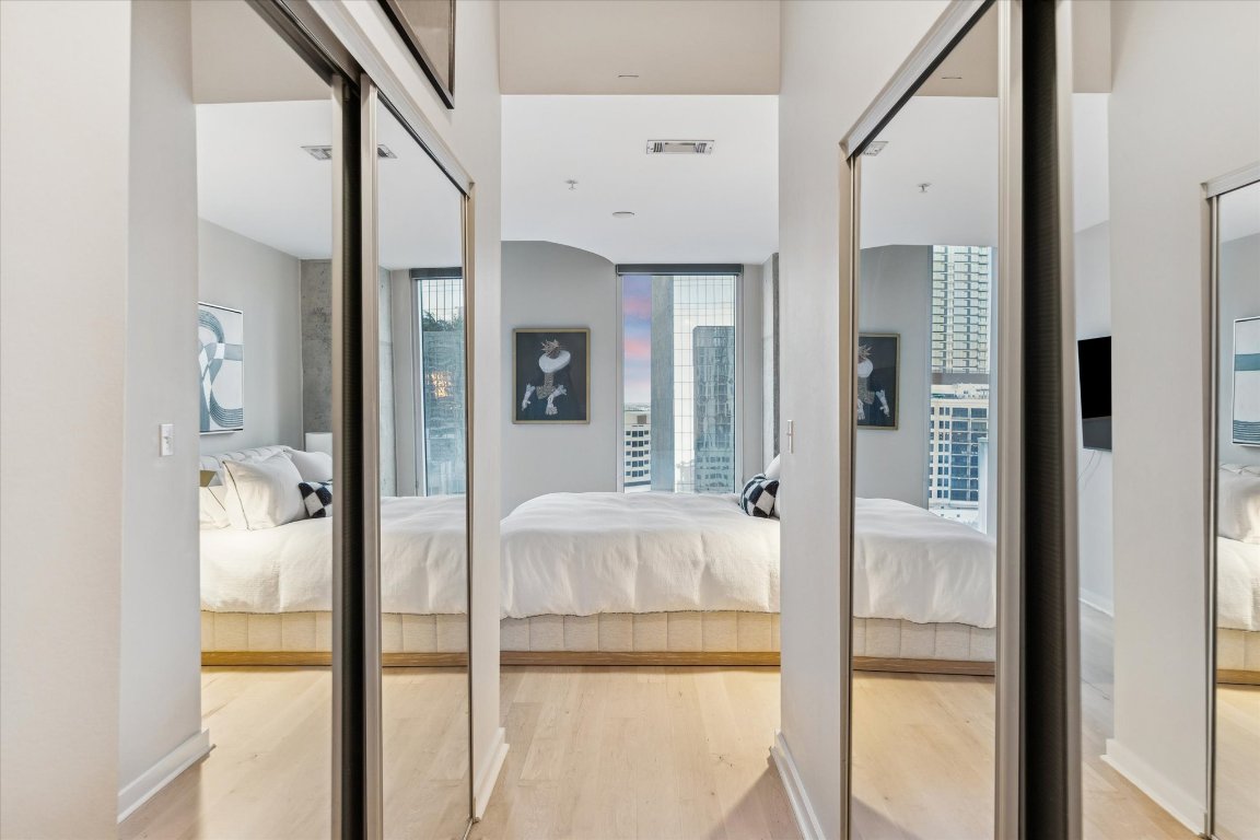 360 Nueces Street, Unit 1417 Austin, TX 78701 - Photo 21 of 40 a bathroom with a tub and shower