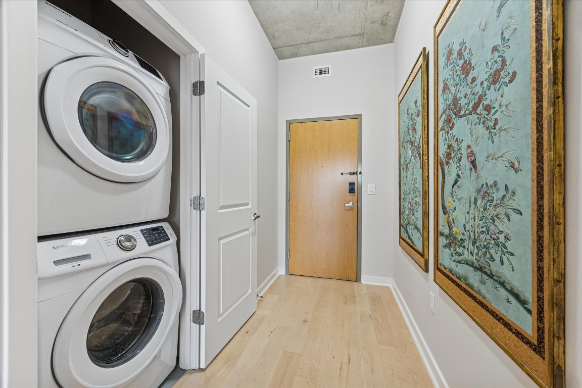 360 Nueces Street, Unit 1417 Austin, TX 78701 - Photo 28 of 40 a view of a hallway with washer and dryer