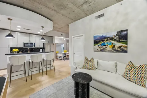 a living room with furniture and a large window