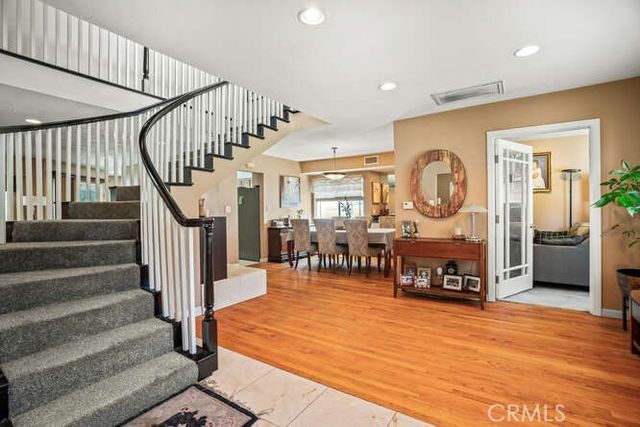 a kitchen with stainless steel appliances granite countertop a stove sink microwave and cabinets