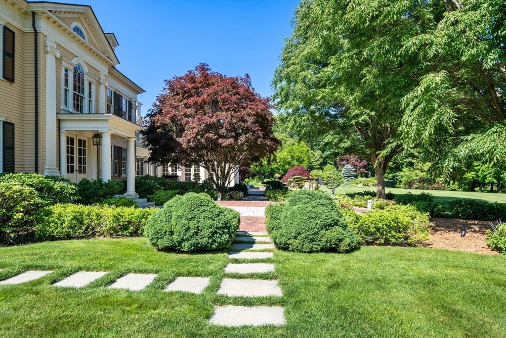 495 Hugh Cargill Road Concord, MA 01742 - Photo 11 of 42 a front view of a house with a yard
