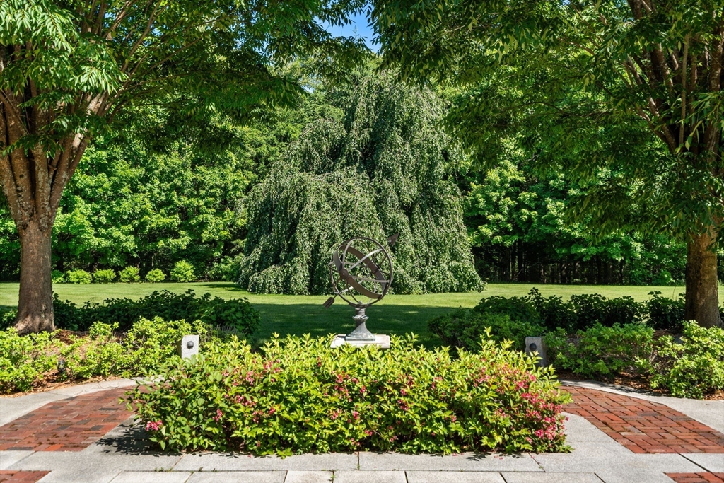 495 Hugh Cargill Road Concord, MA 01742 - Photo 13 of 42 a view of a garden with a flower garden