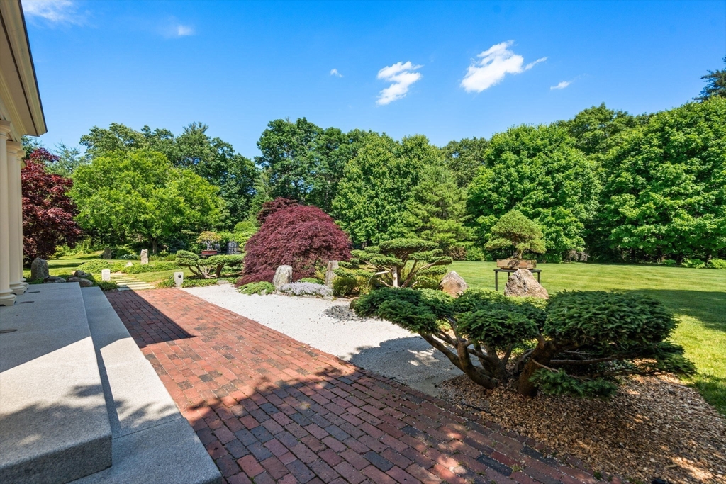 495 Hugh Cargill Road Concord, MA 01742 - Photo 14 of 42 a view of a yard with flower plants