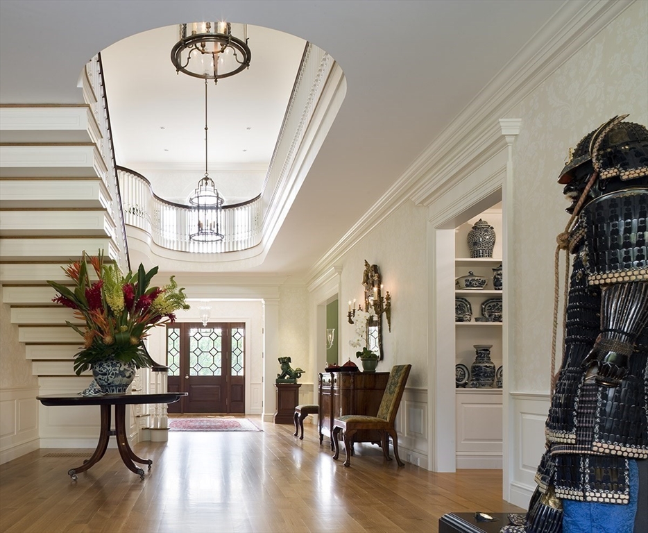 495 Hugh Cargill Road Concord, MA 01742 - Photo 20 of 42 a view of a livingroom with furniture and a chandelier