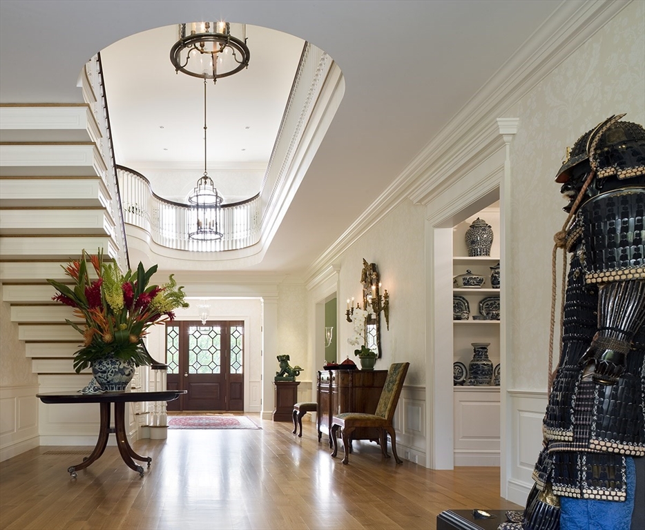 495 Hugh Cargill Road Concord, MA 01742 - Photo 23 of 42 a view of a livingroom with furniture and a chandelier
