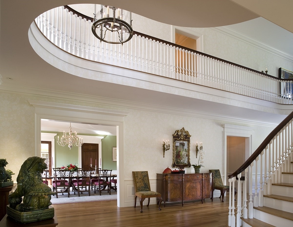 495 Hugh Cargill Road Concord, MA 01742 - Photo 24 of 42 a view of a hallway with wooden floor and windows