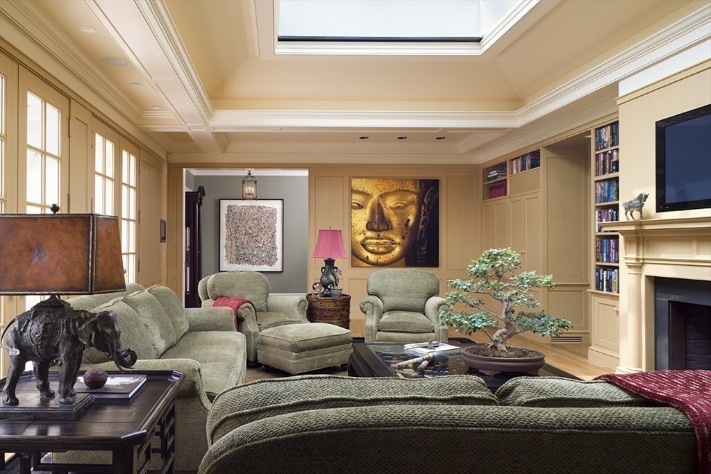 495 Hugh Cargill Road Concord, MA 01742 - Photo 25 of 42 a living room with furniture fireplace and flat screen tv