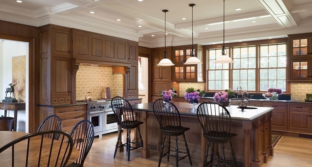 495 Hugh Cargill Road Concord, MA 01742 - Photo 28 of 42 a view of a dining room and livingroom with furniture large windows a chandelier