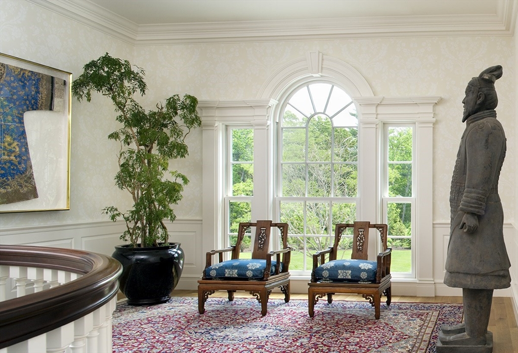 495 Hugh Cargill Road Concord, MA 01742 - Photo 33 of 42 a living room with furniture and a potted plant