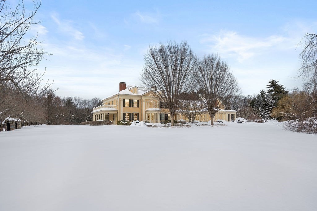 495 Hugh Cargill Road Concord, MA 01742 - Photo 42 of 42 a front view of a house with a yard covered with snow